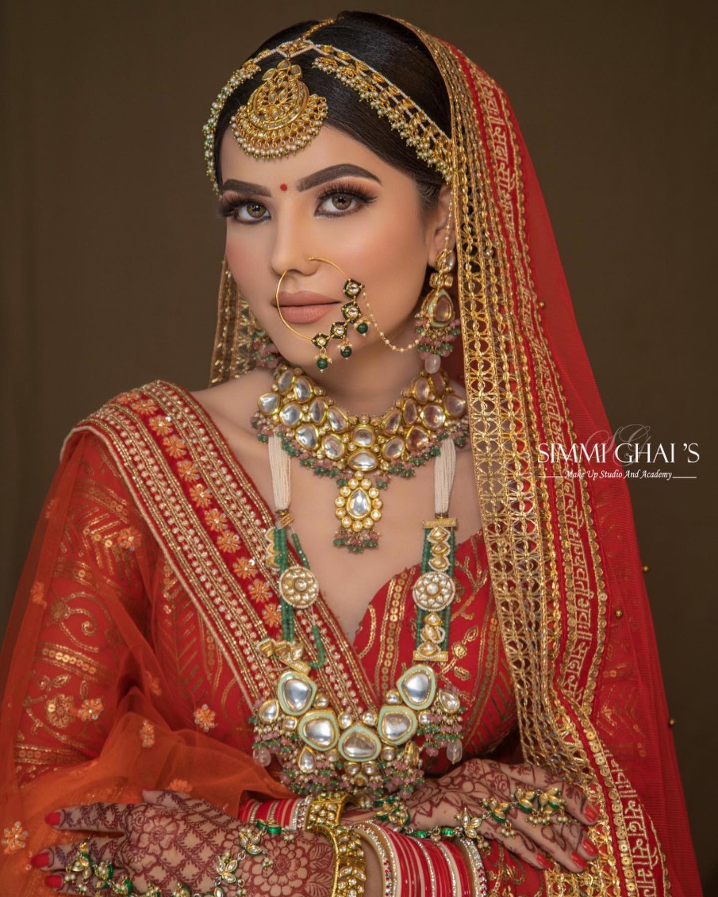 Regal bridal look in a red silk saree | Vip Matrimonial Services